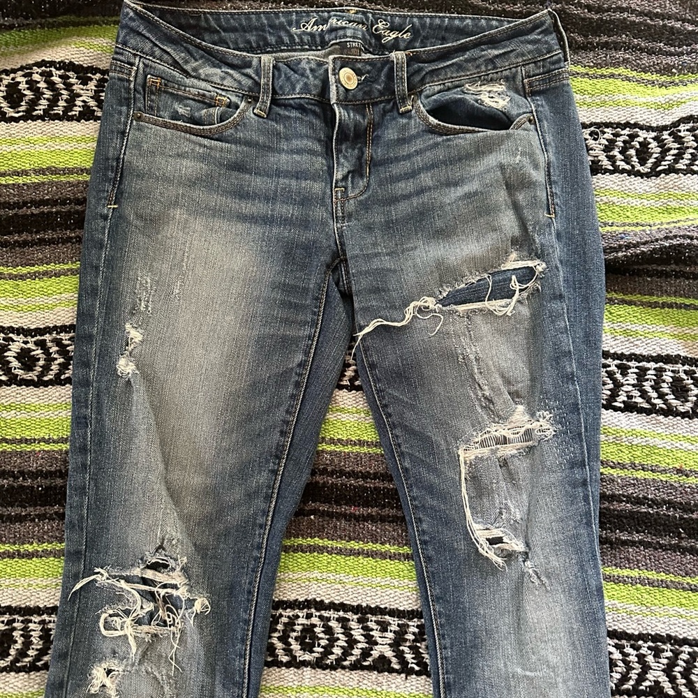 NWOT factory distressed and patched American Eagle Skinny jeans